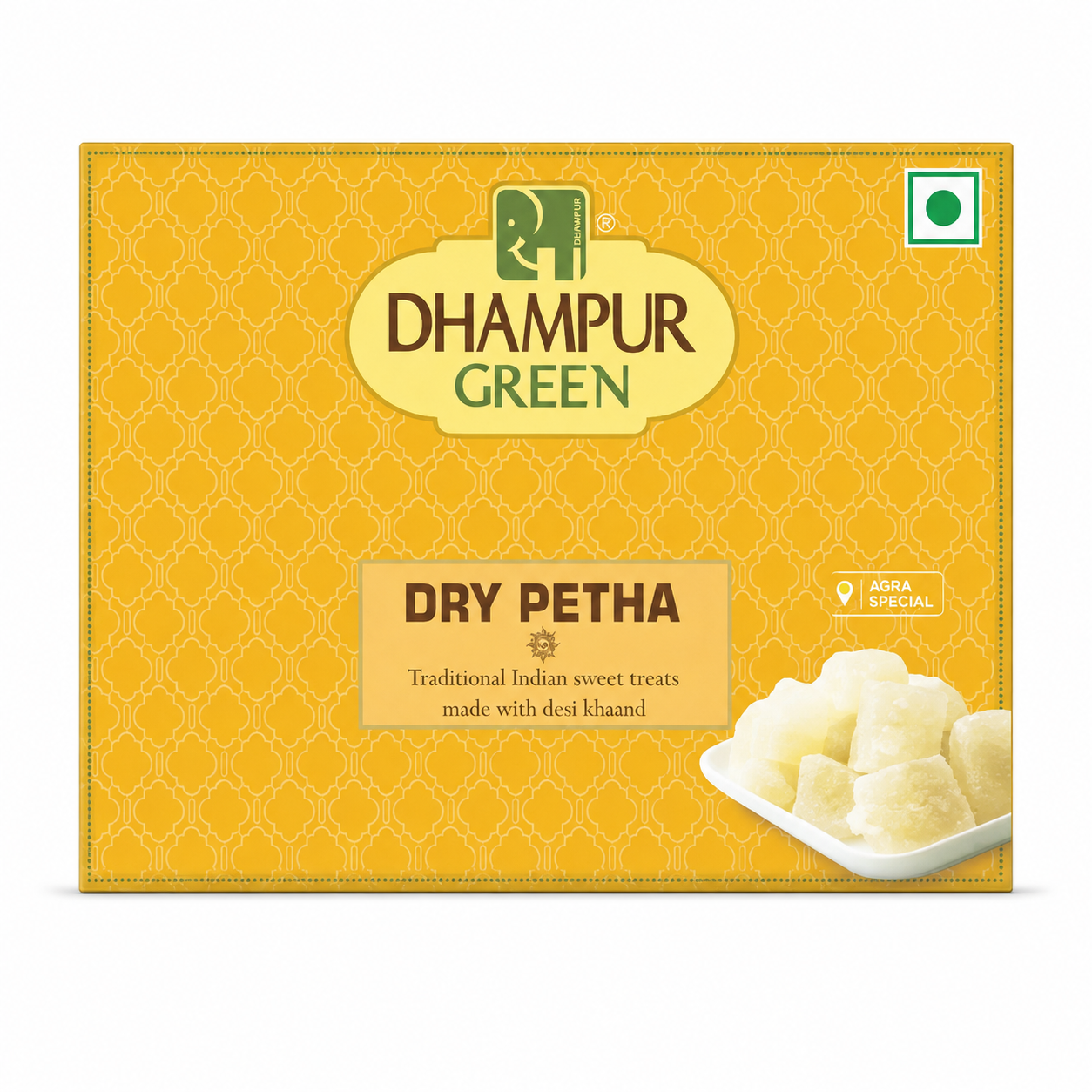 A yellow box of Dhampur Green Dry Petha sweets, featuring a traditional patterned background, the brand logo, and a small photo of the cubed sweets on a white plate.