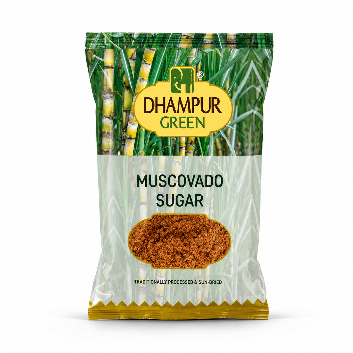 A package of Dhampur Green Muscovado Sugar, featuring a clear plastic bag with a green sugarcane illustration, a yellow brand logo, and a clear lower section showing the brown sugar inside.